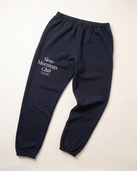 Navy Slow Mornings Club graphic sweatpants with elastic cuffs