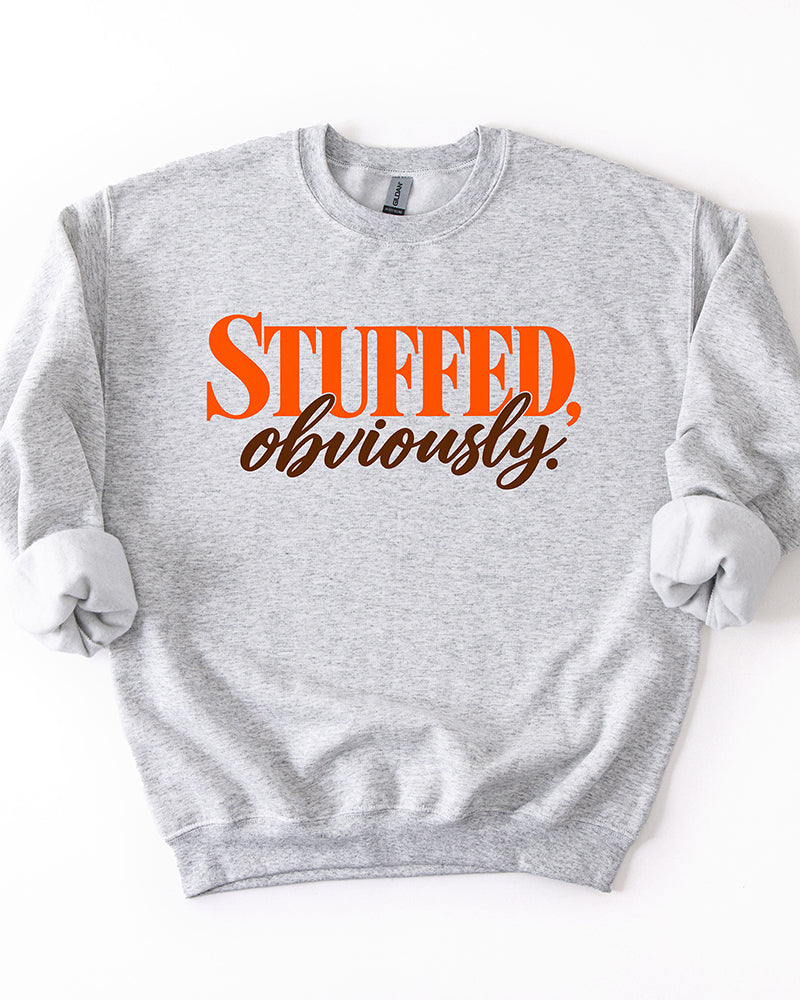 Ash gray Stuffed, Obviously Thanksgiving crewneck sweatshirt with orange block lettering and brown cursive script.
