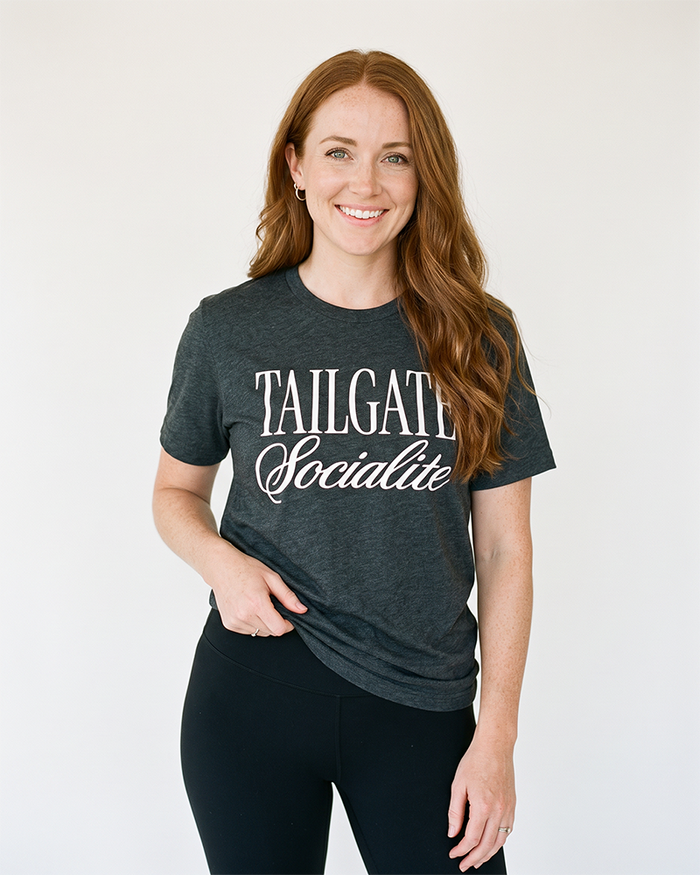 Woman wearing Tailgate Socialite dark grey heather game day tee