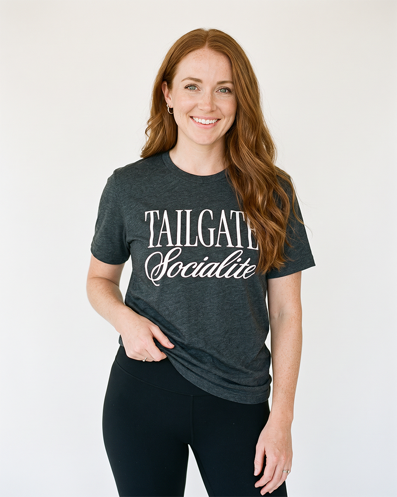 Woman wearing Tailgate Socialite dark grey heather game day tee