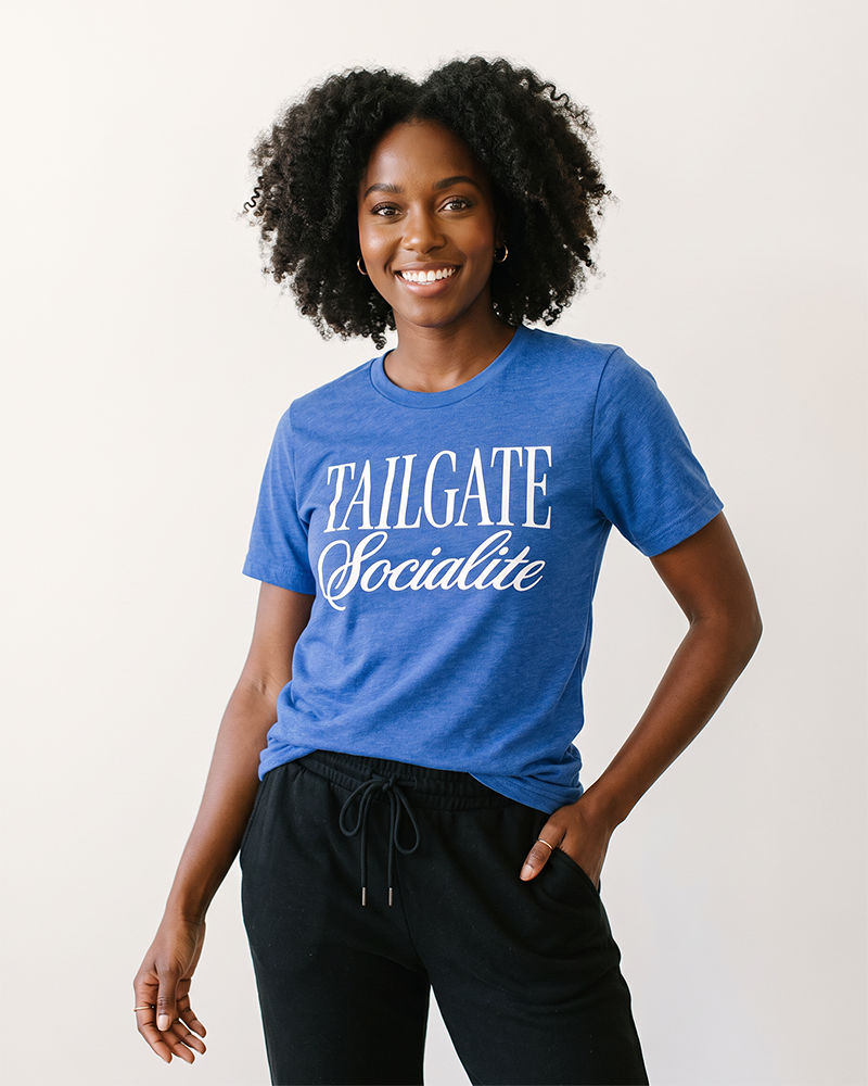 Woman wearing Tailgate Socialite heather royal blue game day graphic tee