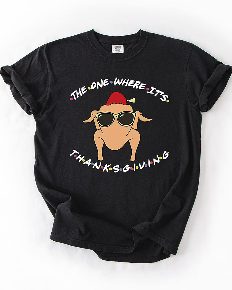 Black heavyweight Thanksgiving graphic T-shirt featuring a cartoon turkey wearing sunglasses and a fez with The One Where It's Thanksgiving lettering.