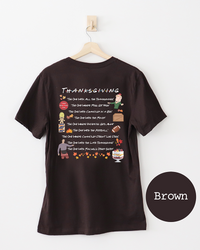 Back of brown Friends-inspired Thanksgiving T-shirt featuring colorful illustrations referencing memorable Thanksgiving episodes.