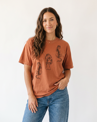 Woman wearing Yam heavyweight tiger graphic tee with blue jeans