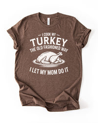 Heather Brown Thanksgiving graphic T-shirt with vintage white roasted turkey illustration and funny I Let My Mom Do It slogan.