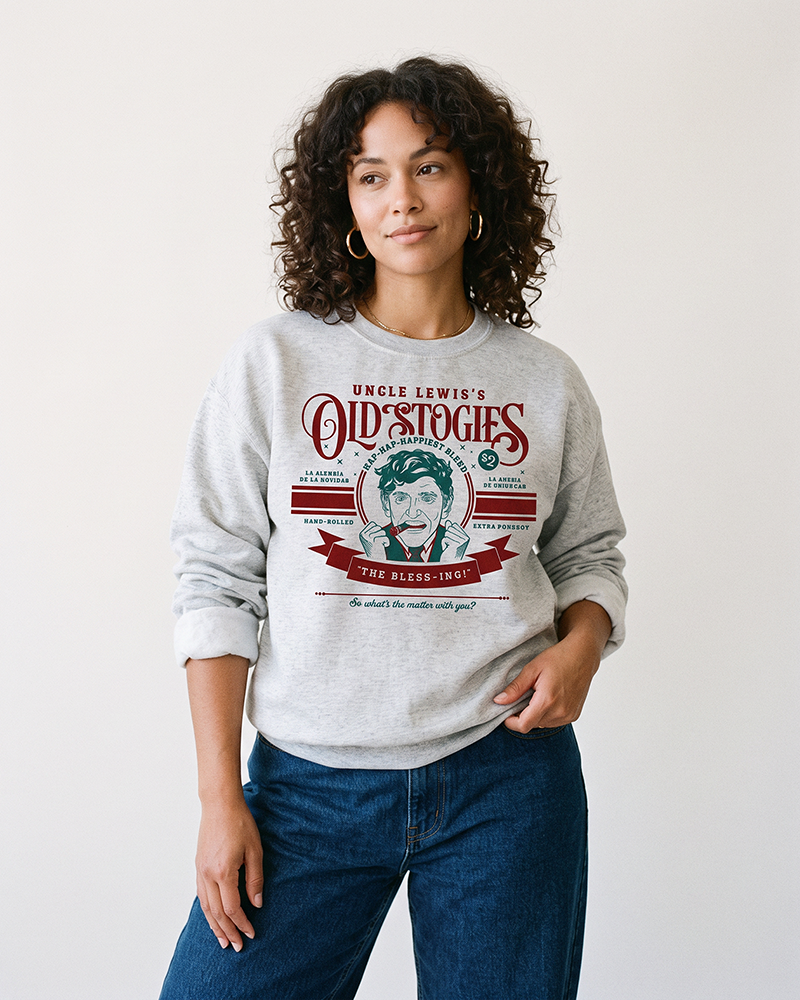 Woman wearing ash gray Uncle Lewis Old Stogies Christmas sweatshirt with blue jeans