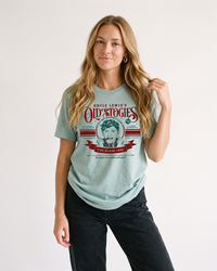Woman wearing Uncle Lewis Old Stogies lightweight Christmas graphic tee with black jeans